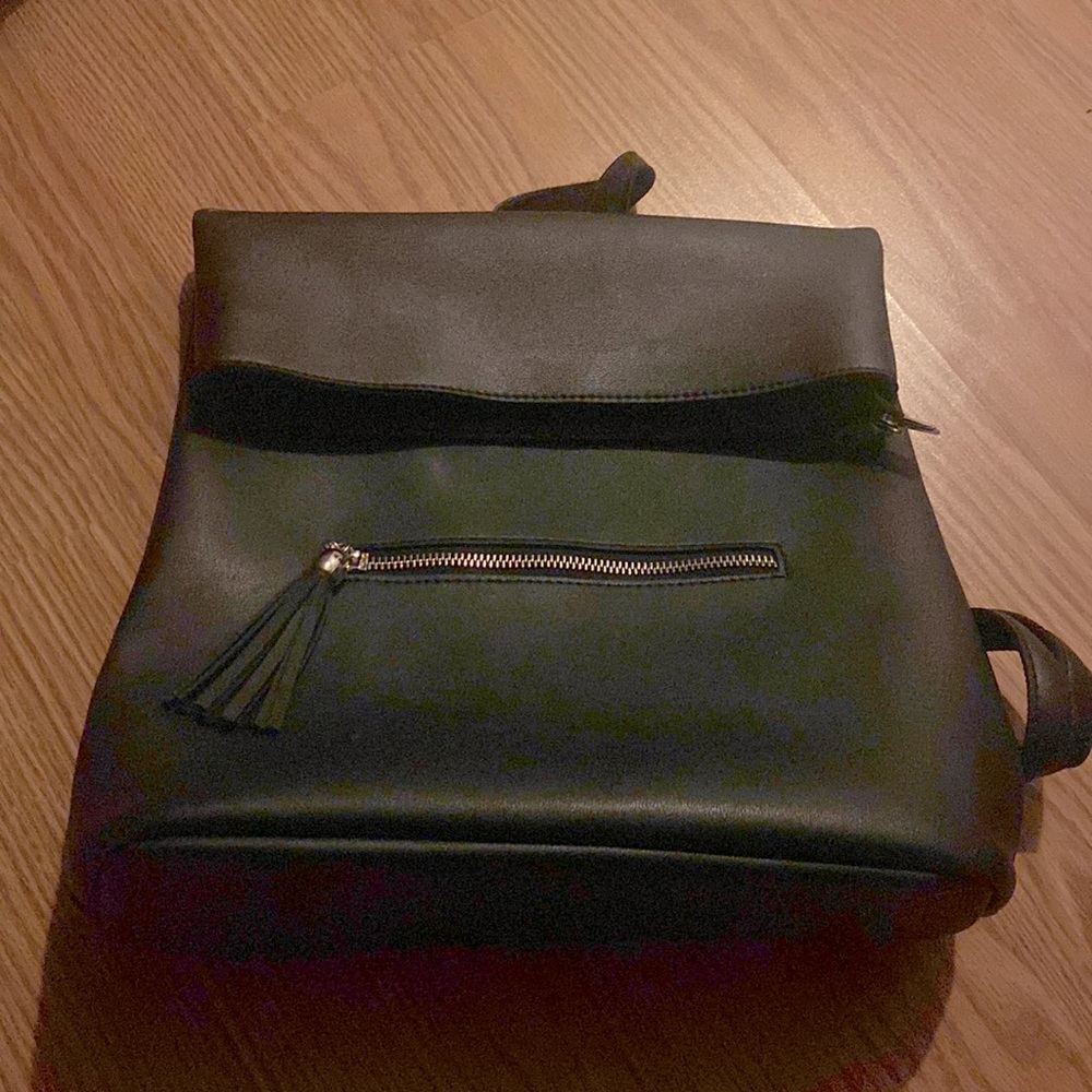 Black handbag/backpack. Fake leather. Gently used.